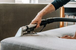 Professional cleaning service deep cleaning sofa at home.